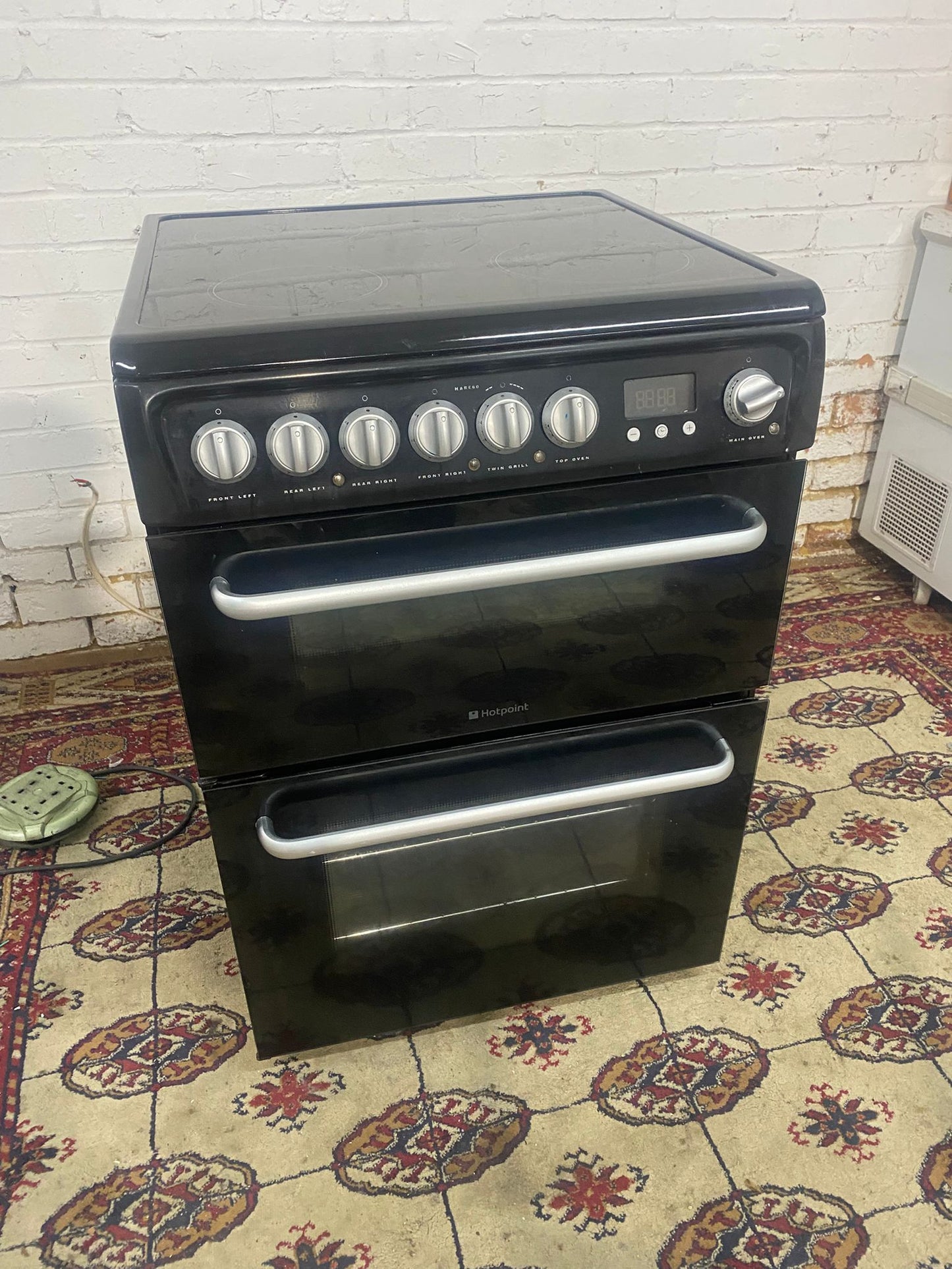 TopBrand Hotpoint 60CM  Black Electric Ceramic Cooker With Dual Oven/Grill 
For sale