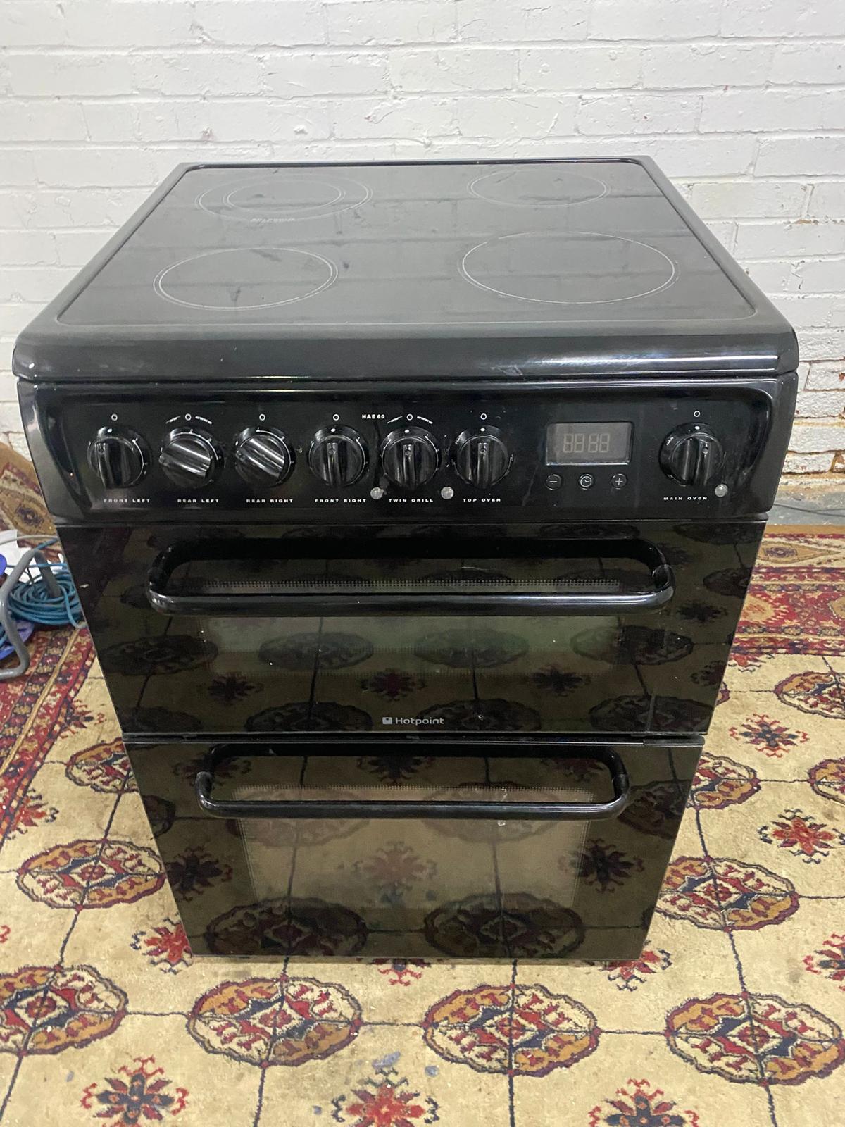 🚚Beautiful HotPoint Black 60CM Electric Ceramic Cooker With Dual Oven/Grill For Sale
